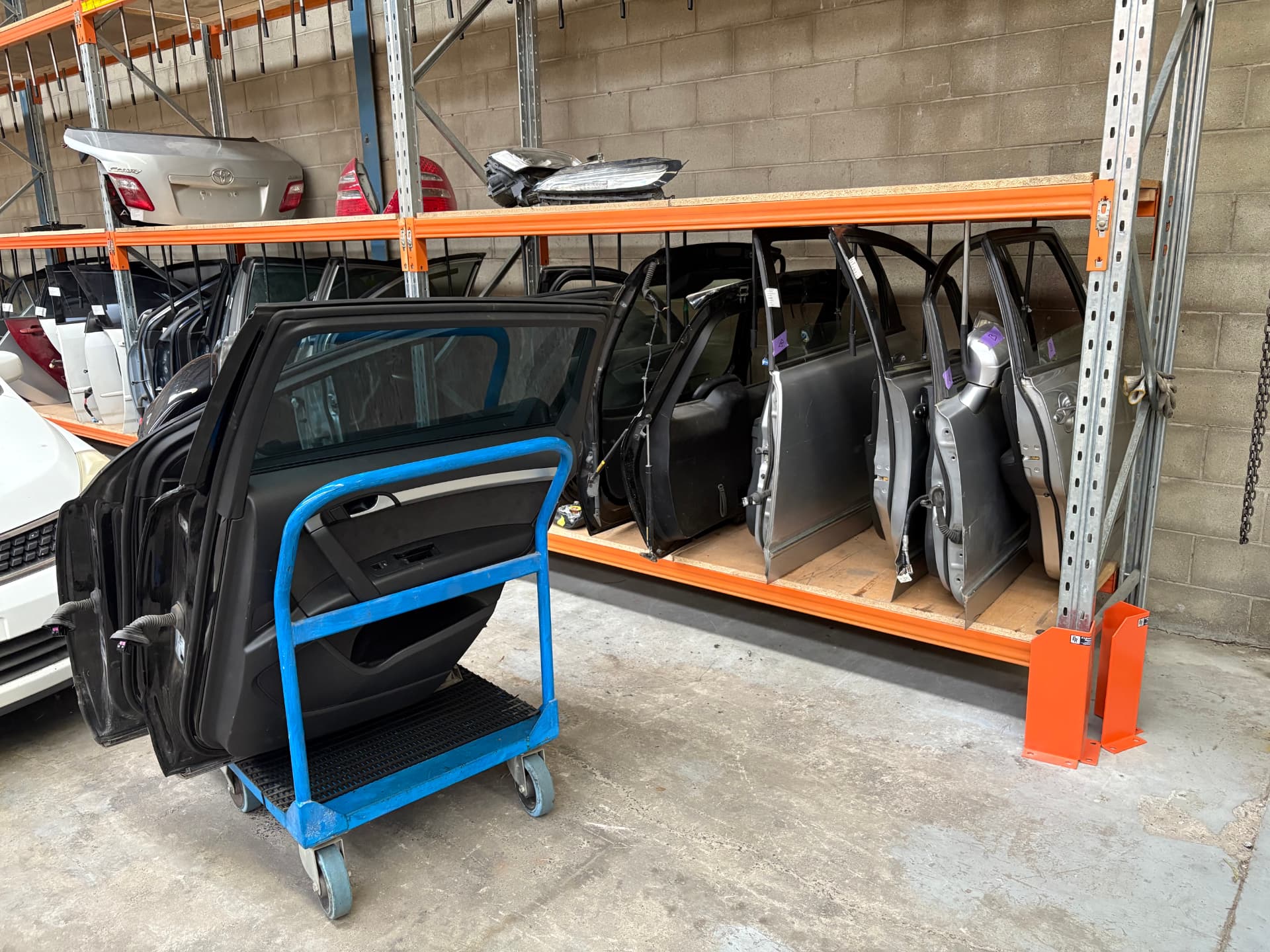 Quality used parts neatly stocked on warehouse shelves
