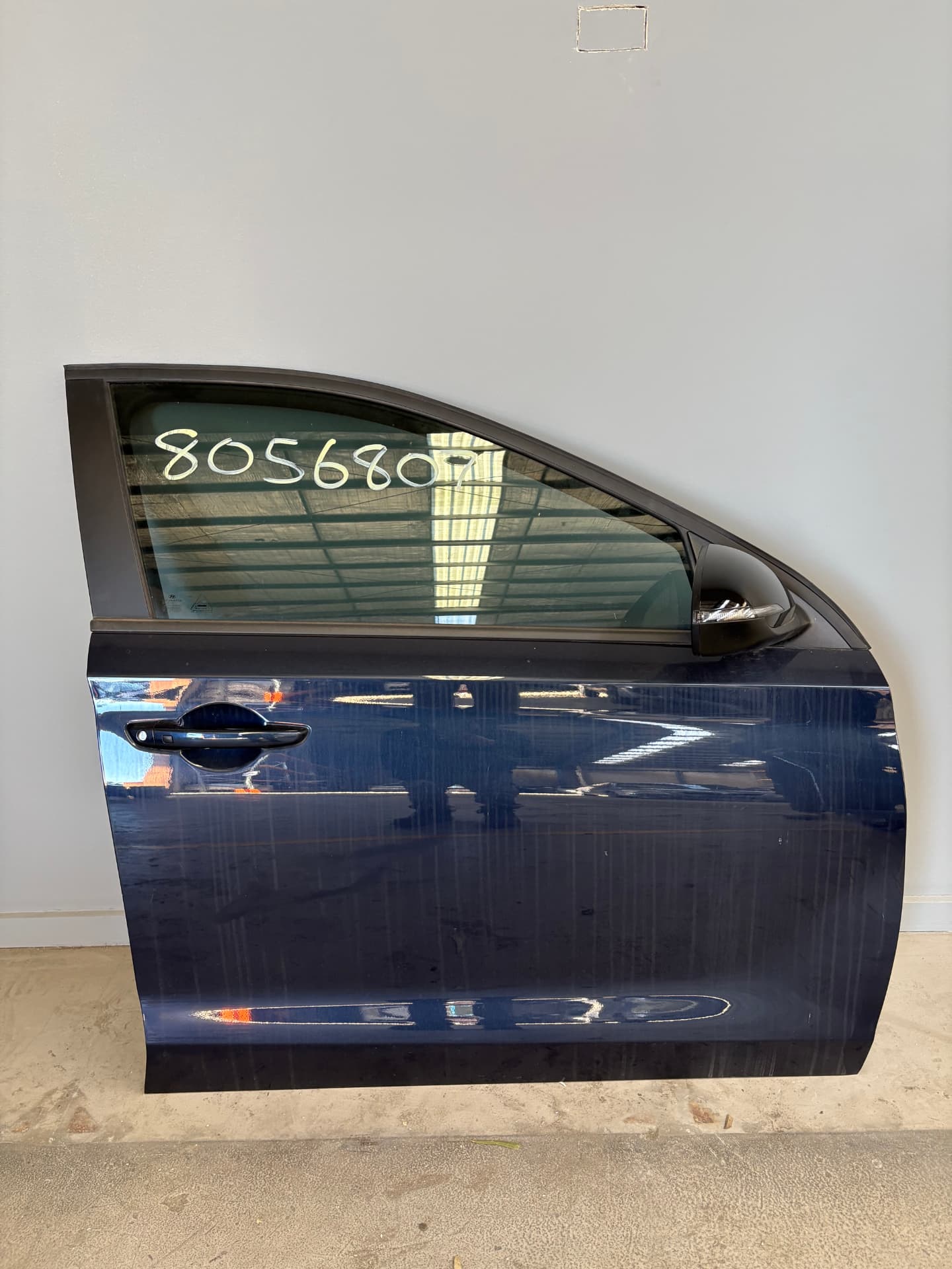 Used car door photographed and quality checked after dismantling